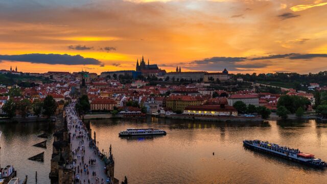 Sunset behind the Prague Castle and Charles Bridge