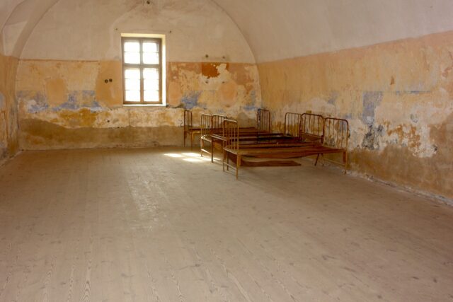 Beds in Terezín concentration camp, able to see on a day trip from Prague.